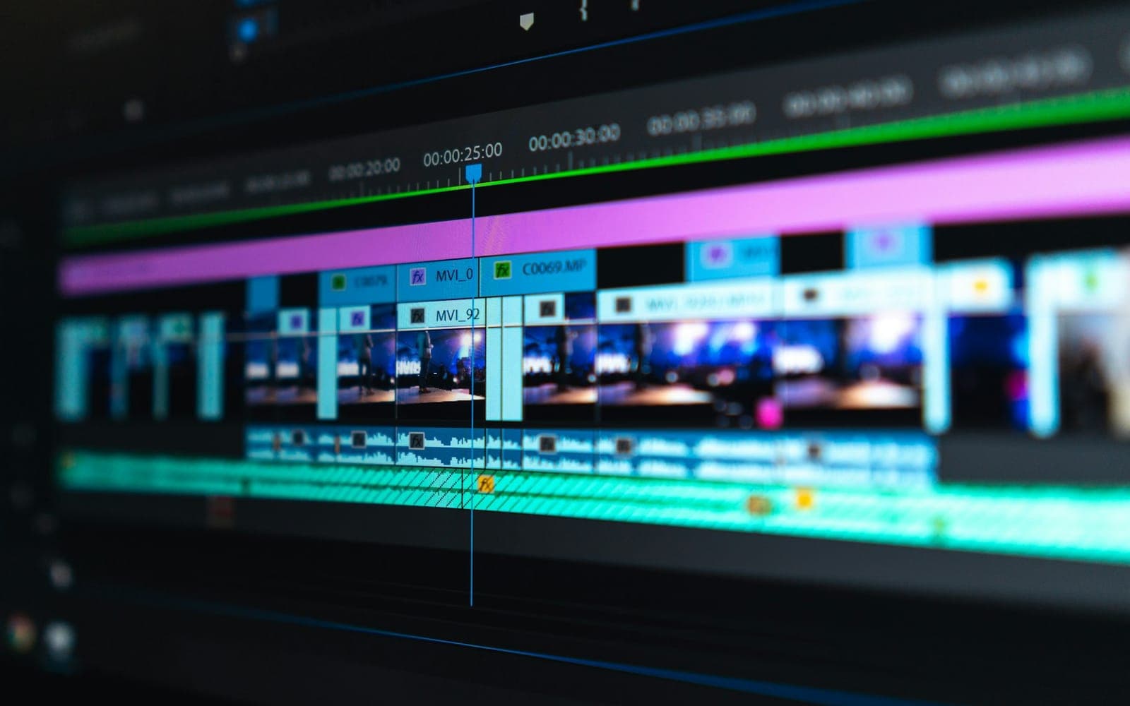 Video editing timeline glowing on a production monitor