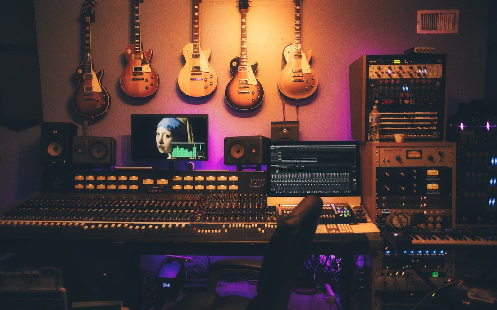 Audio waveform mixing desk with studio headphones