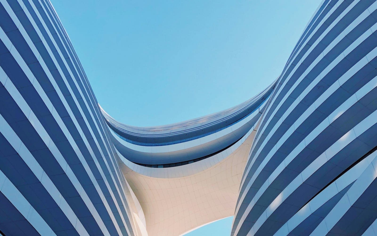 Curved modern building forms illustrating building information modelling concepts