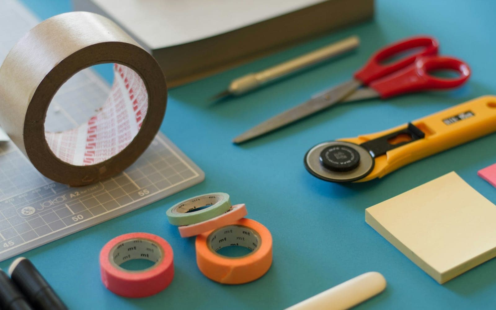 Colourful craft and design tools arranged for graphic template work