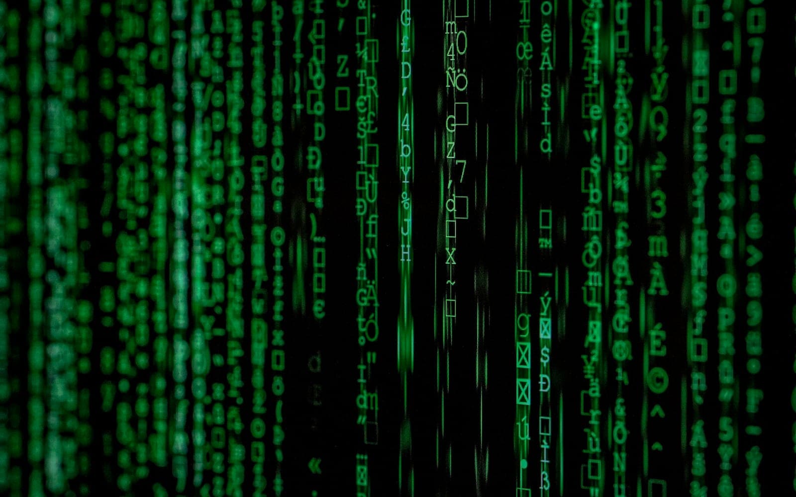 Cascading green digital code representing AI-assisted productivity work
