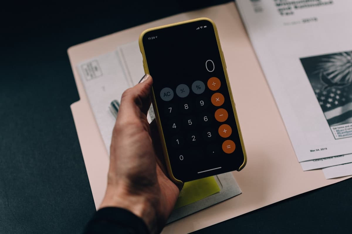 Financial analysis documents, calculators, and building project blueprints