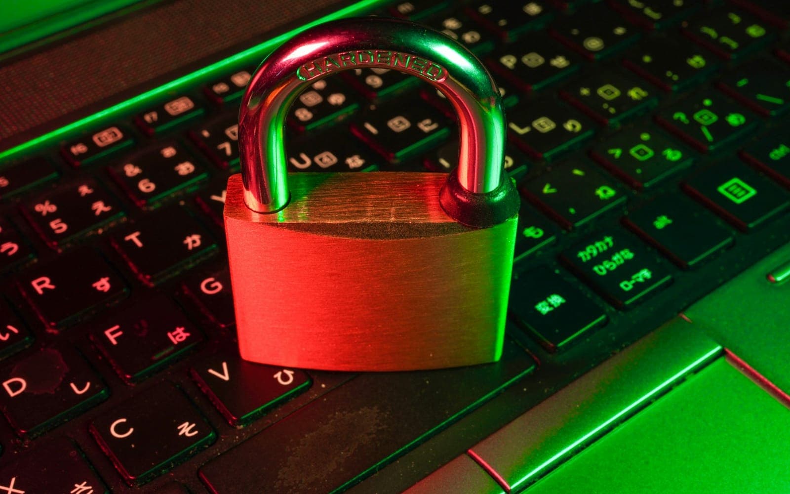 Padlock icon over a laptop representing information security