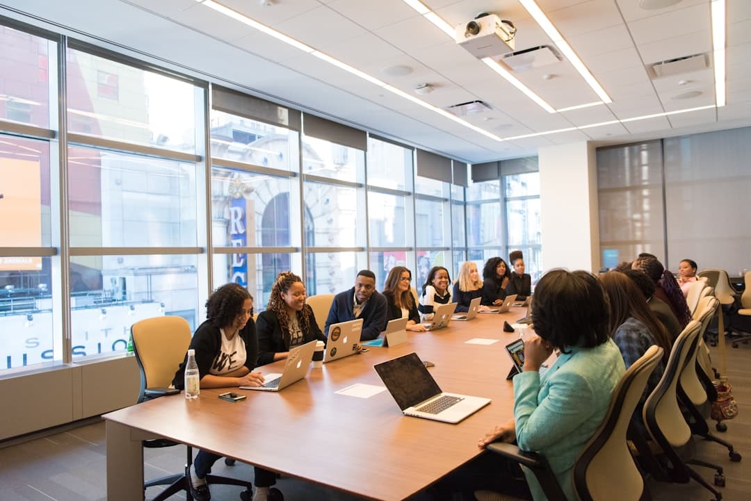 Finance professionals reviewing budgets and reports around a table