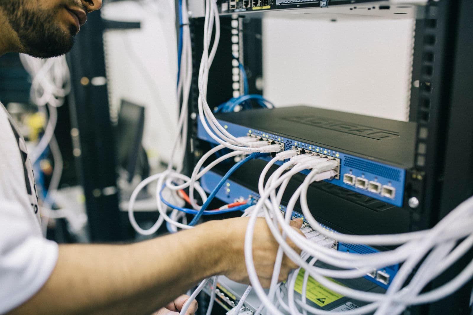 Ethernet network cables connected to a networking switch in a training lab