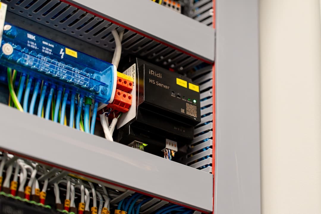 Industrial electrical control panel with PLC wiring and components