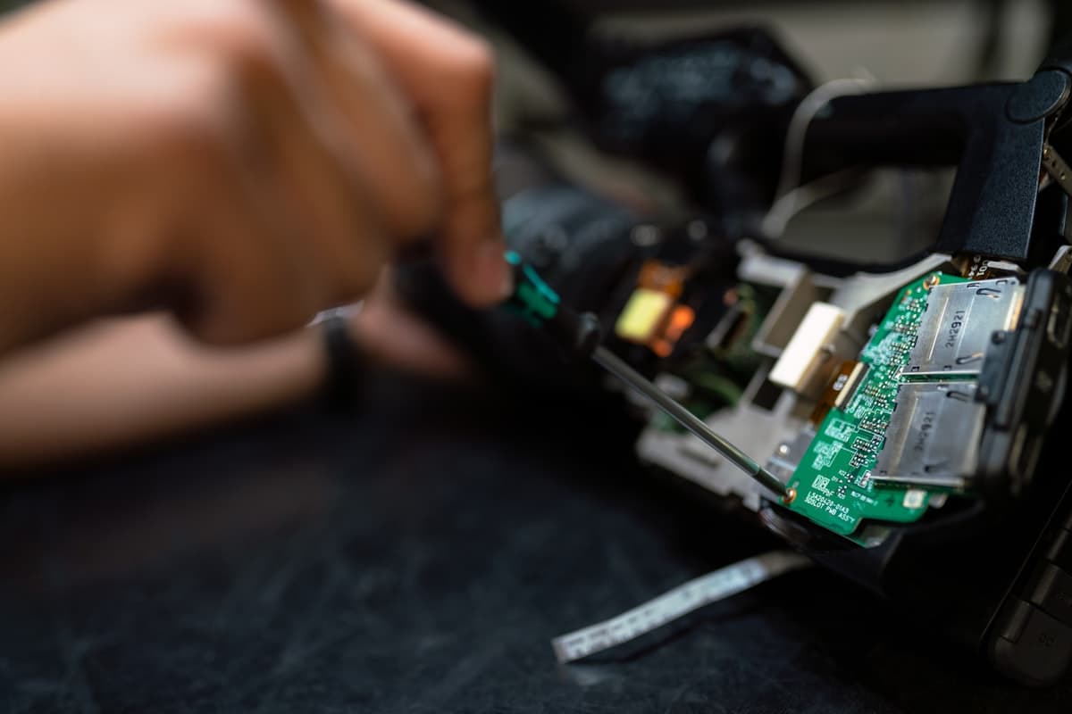 Engineer testing industrial electronic components and machinery