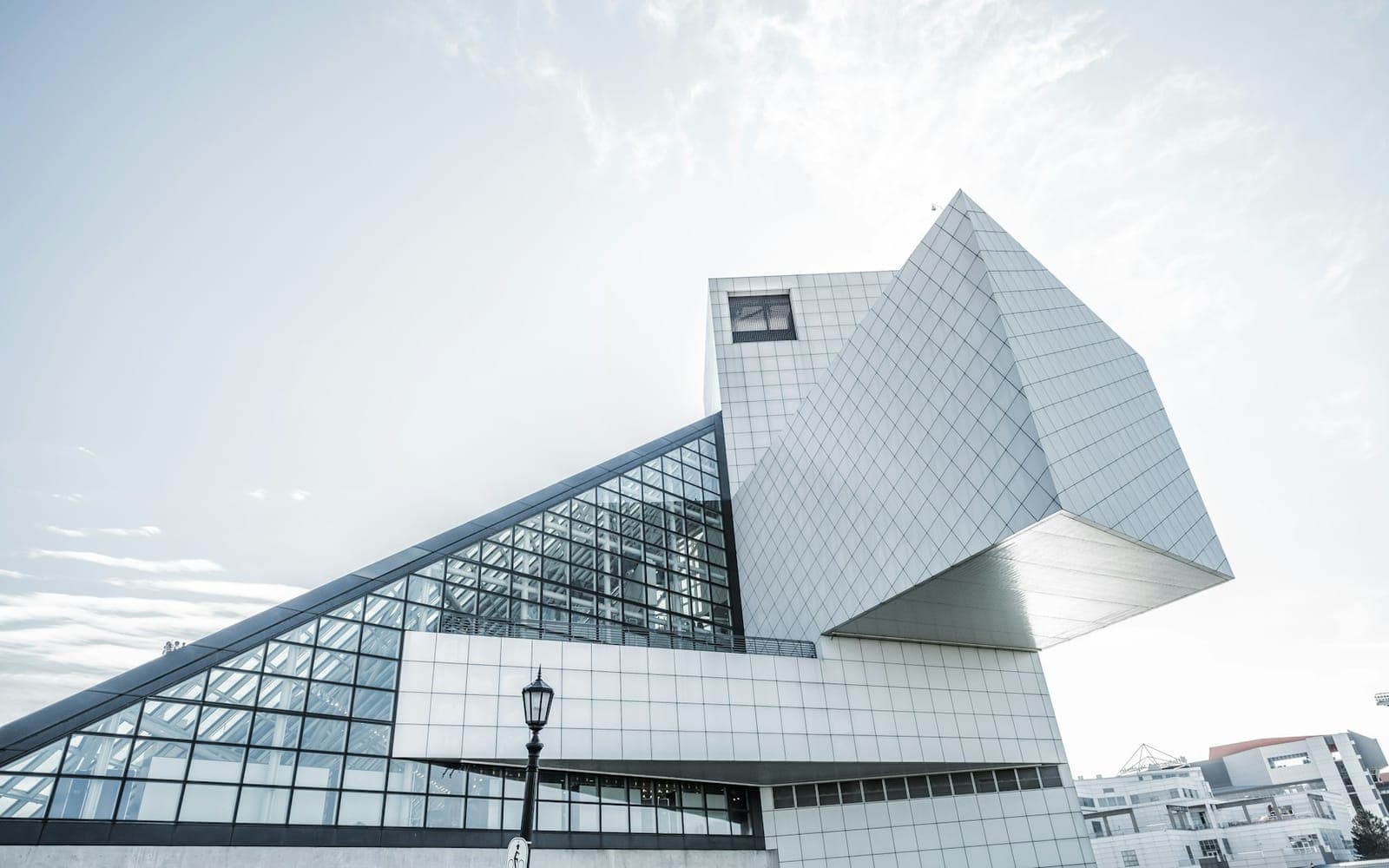 Bold geometric modern architecture facade with glass and white panels