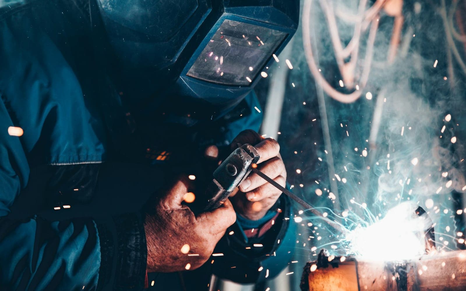 Welder joining metal components for mechanical and MEP installation work