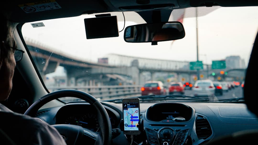 Engineer driving a vehicle with GPS/drive-test equipment running